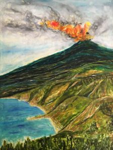 Volcano erupting near coast and green hills.