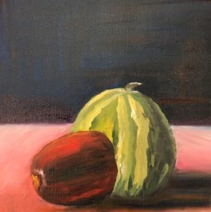 Watermelon and papaya on a table.