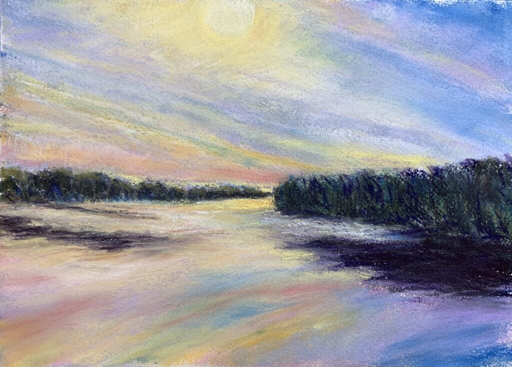Colorful sunset over a tranquil river landscape.