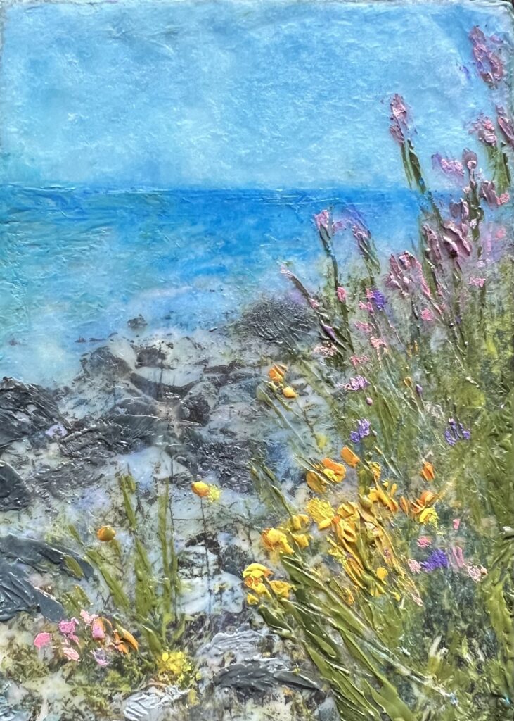 A painting of flowers and water on the beach.