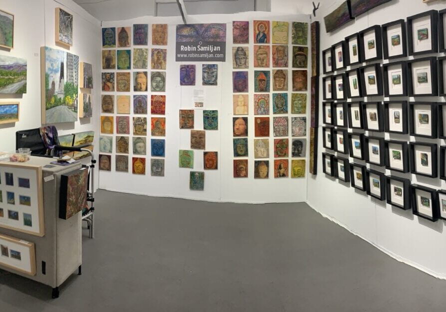 Art gallery with various framed artworks displayed.