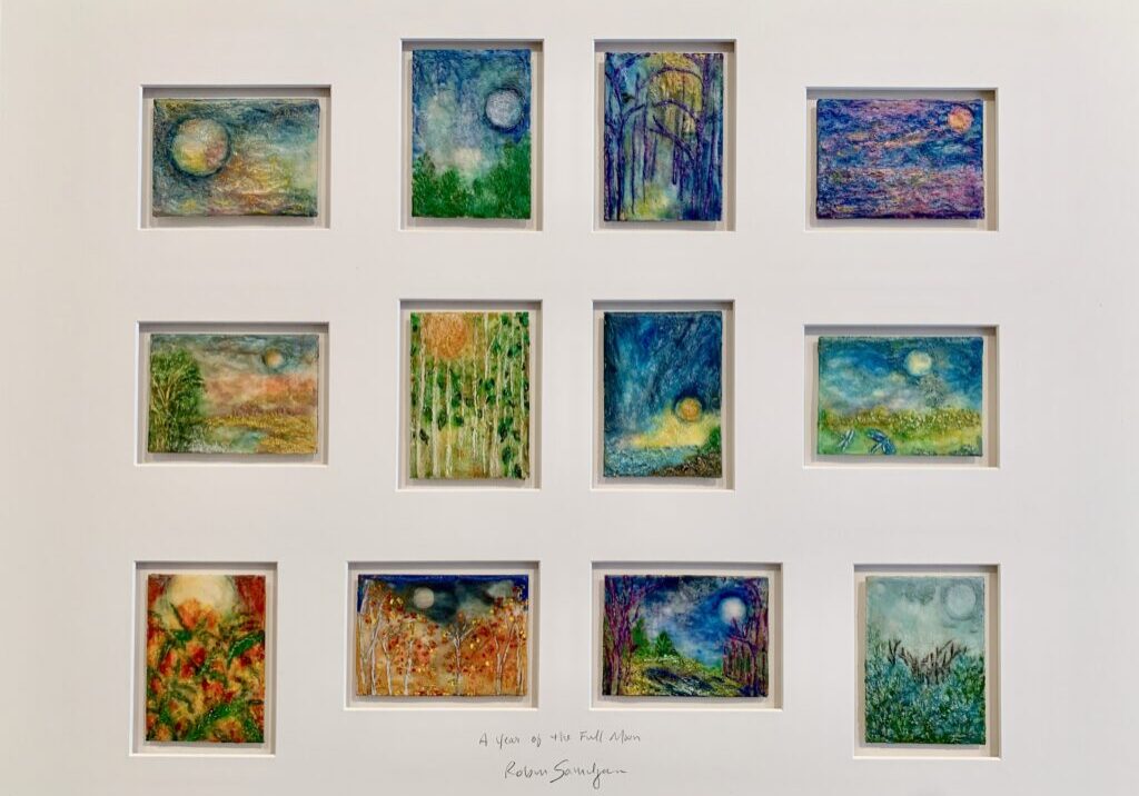 Twelve colorful abstract landscape paintings in frame.