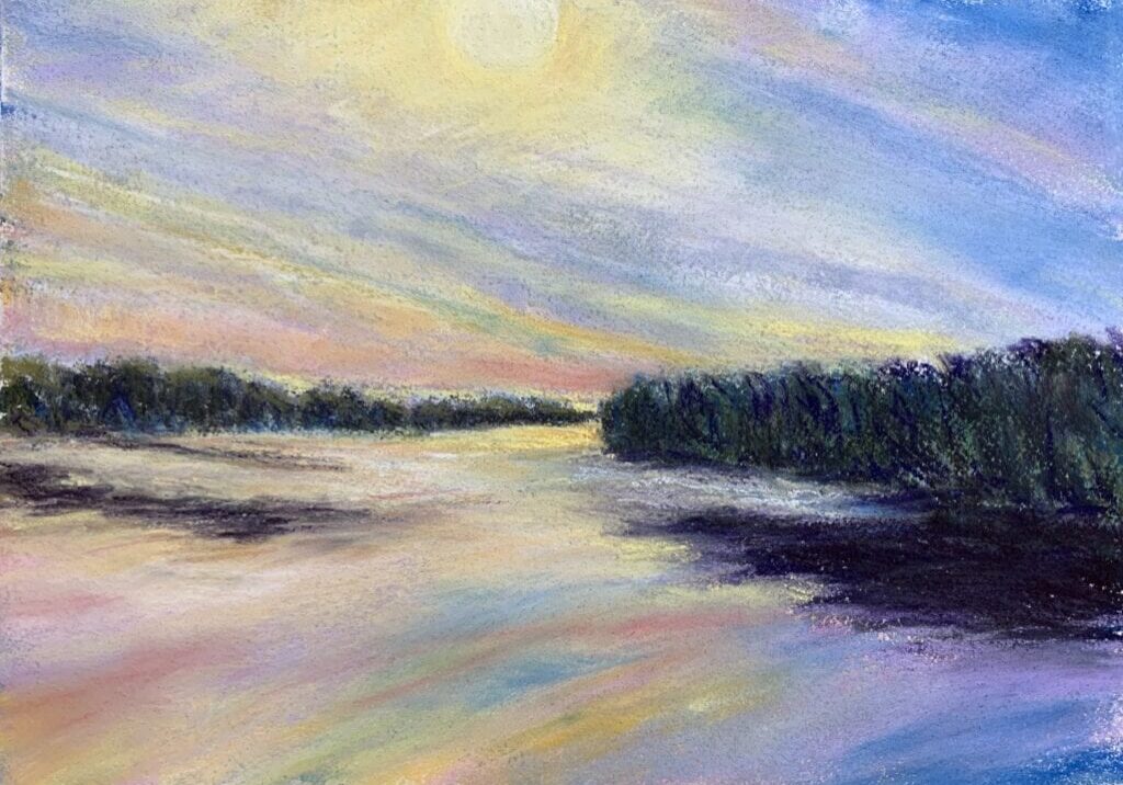 Colorful sunset over a tranquil river landscape.